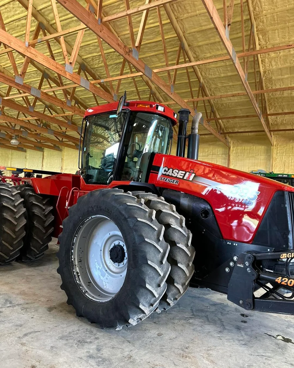 Ceramic-coated Case IH Steiger articulated tractor in a barn